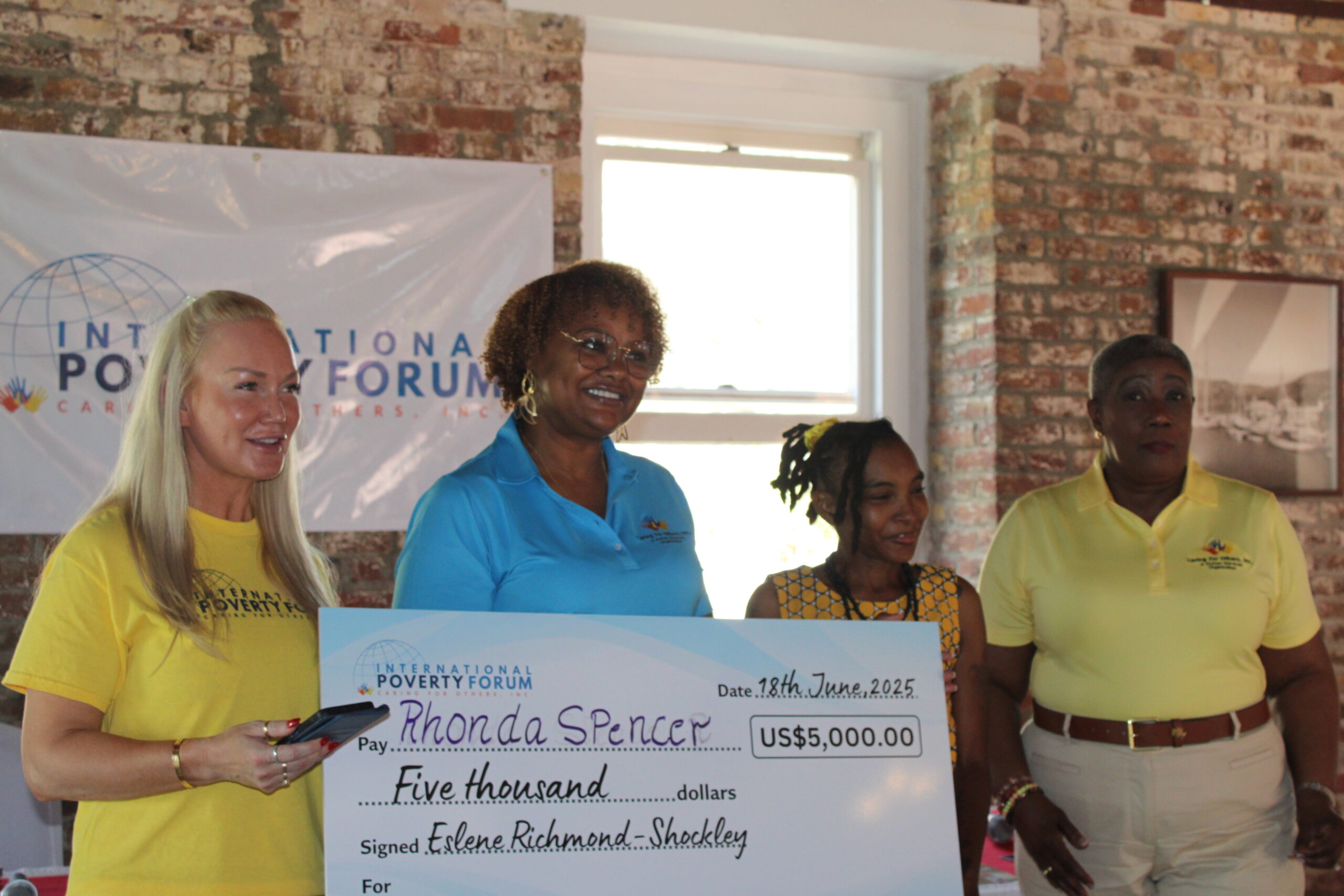 Rhonda Spencer (centre right) alongside the Caring for Others Inc founder Eslene Richmond-Shockley (right), Board Chair Crystal Khalil (centre left) and board member Meagan Howell (left), during their press conference.